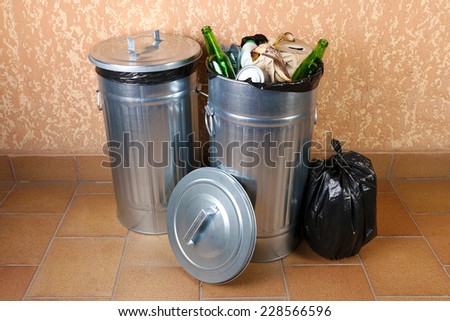 Recycling bins on wall background