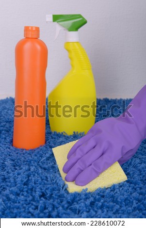 Cleaning carpet with cloth close up