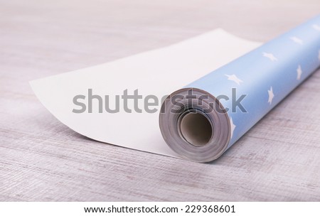 Wallpaper roll on floor