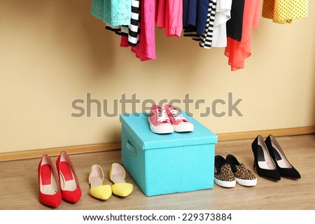 Colorful clothes and shoes in room Colorful clothes and shoes in room