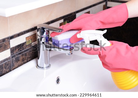 Cleaning bathroom sink close-up