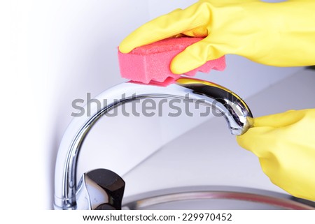 Cleaning kitchen sink close-up
