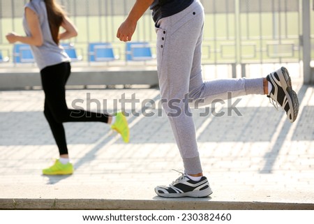 Young people jogging at park