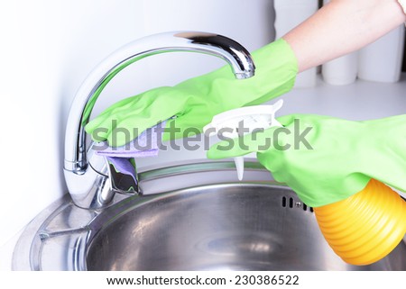Cleaning kitchen sink close-up
