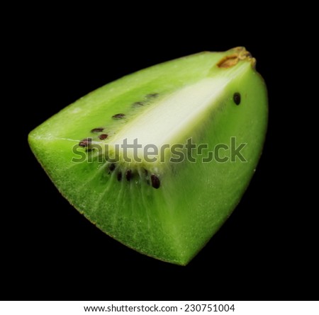 Kiwi slice on black background