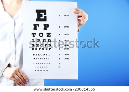 Health care, medicine and vision concept - woman with eye chart