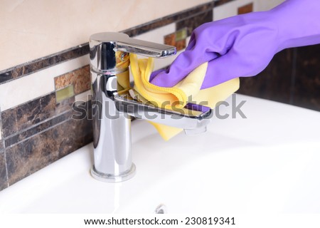 Cleaning bathroom sink close-up