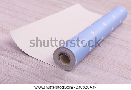 Roll wallpaper on floor