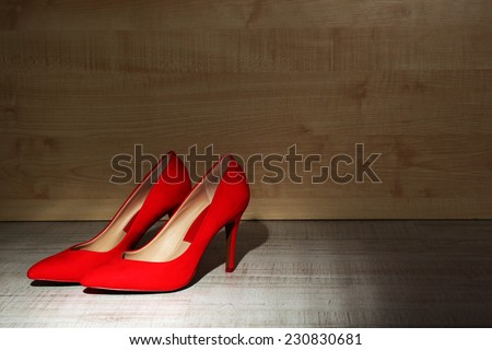Red women shoes on floor in room
