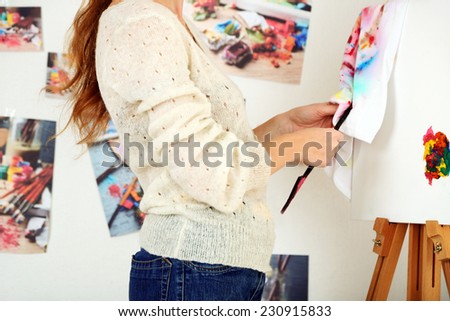 Artist painter on canvas in art studio