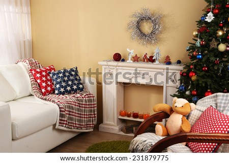 Beautiful Christmas interior with decorative fireplace and fir tree