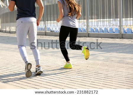 Young people jogging at park