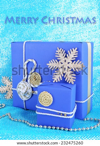Dark blue gift boxes on blue fabric background