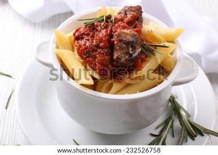 Tasty pasta with meat in ceramic pot