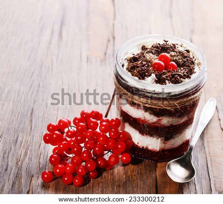 Delicious dessert in jar on table close-up