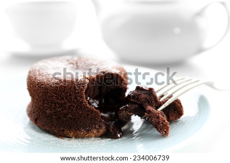 Hot chocolate pudding with fondant centre on plate, close-up