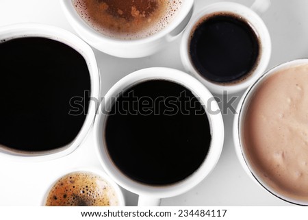 Lots of coffee cups on white background