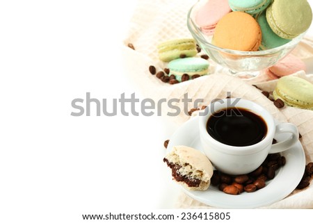Gentle colorful macaroons in glass bowl and black coffee in mug isolated on white