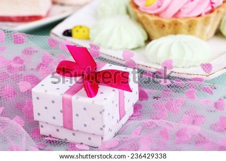 Cute gift on birthday table close-up