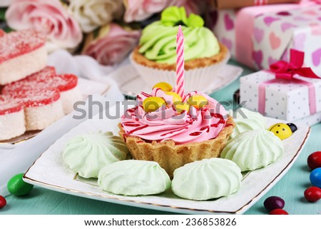Sweet cakes on birthday table close-up