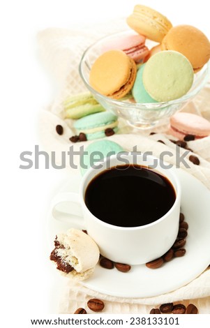 Gentle colorful macaroons in glass bowl and black coffee in mug isolated on white