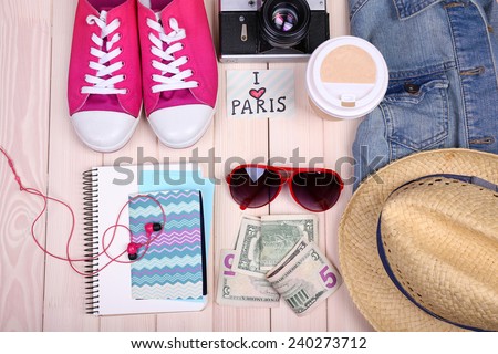 Travel things for traveling on wooden background top view