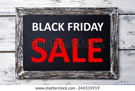 Vintage sign board with Black Friday Sale text on it on wooden background