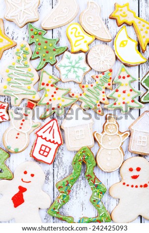 Christmas gingerbread cookies on color wooden table background