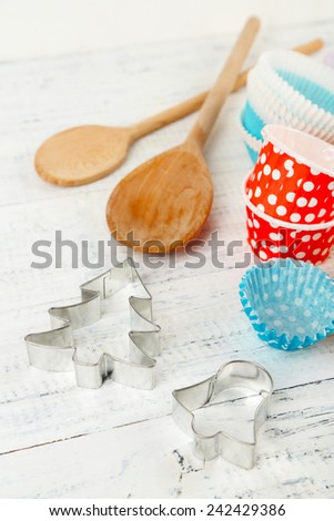 Kitchen molds for baking on color wooden background