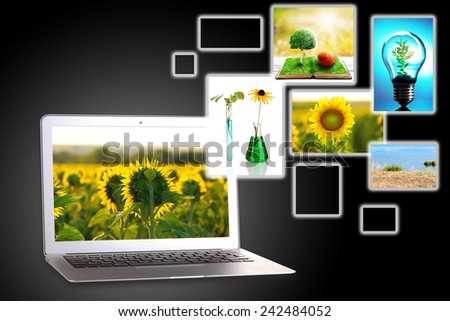 Laptop and eco theme images on dark grey background