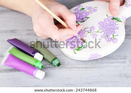 Hand paints on hand made cutting board and art materials