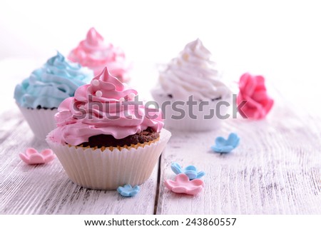 Delicious cupcakes on table close-up Delicious cupcakes on table close-up
