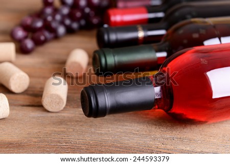 Different bottles of wine on table close-up