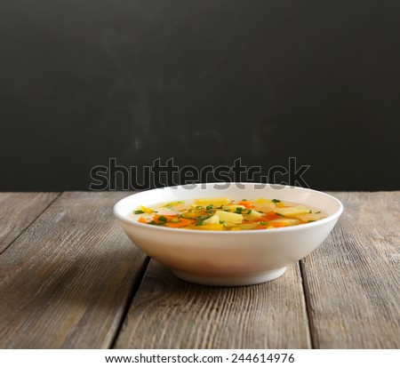 Delicious home cooked food with steam on table on grey background