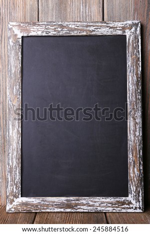 Menu board on rustic wooden planks background
