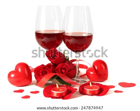 Composition with red wine in glasses, red roses, ribbon and decorative hearts on light background