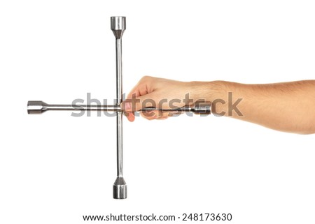 Cross wrench in male hand isolated on white
