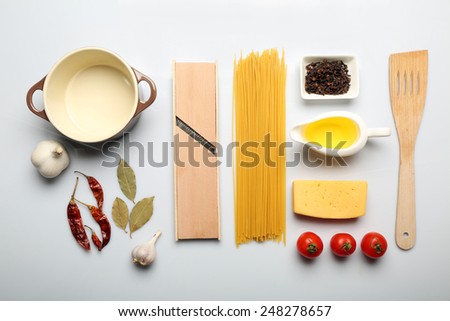 Food ingredients and kitchen utensils for cooking isolated on white