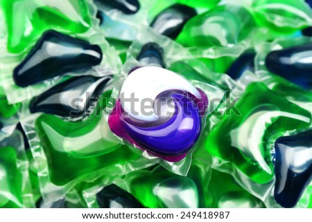 Gel capsules with laundry detergent close up
