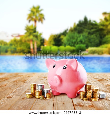 Piggy bank on beach background