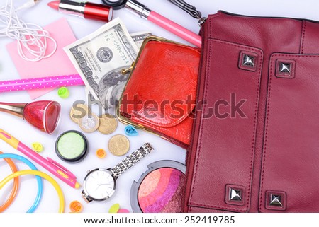 Ladies handbag and things with accessories of it isolated on white