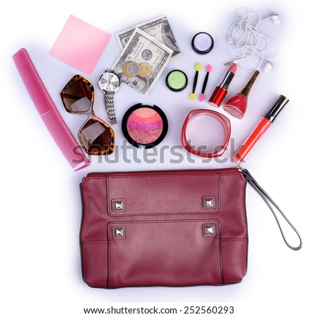 Ladies handbag and things with accessories of it isolated on white
