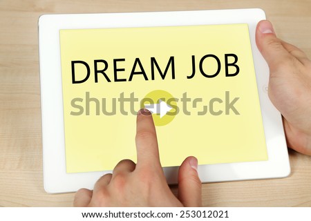 Tablet PC in hands and Dream Job text on screen, Job searching concept