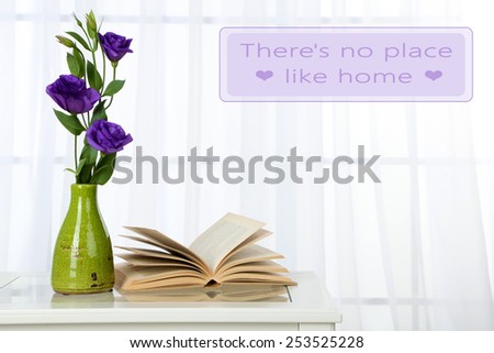 Beautiful flowers in vase on window background and space for your text