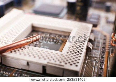 Repairing of computer motherboard, macro view