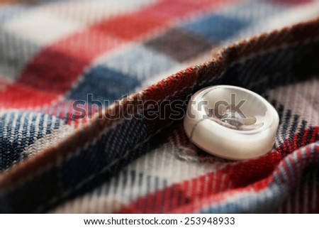 Button on clothes close up