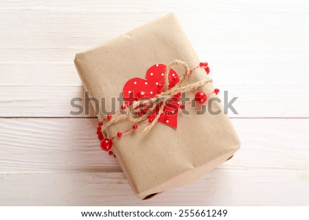 Beautiful gift box on wooden table. Valentine Day concept