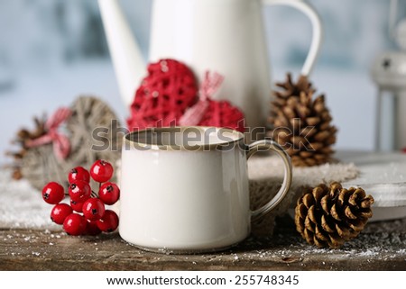 Winter composition with hot beverage on nature background
