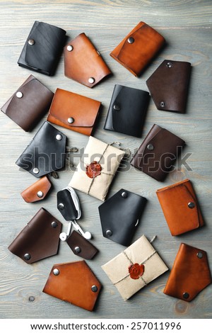 Different hand made leather man accessories on wooden background