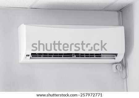 Air conditioner on wall background